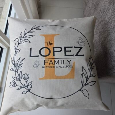 Personalized family name pillow cover in woven linen, front view