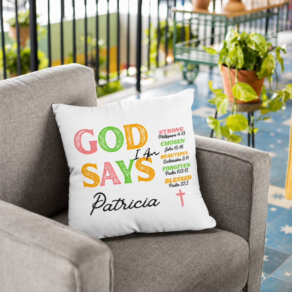 God Says personalized scripture throw pillow styled on a grey chair